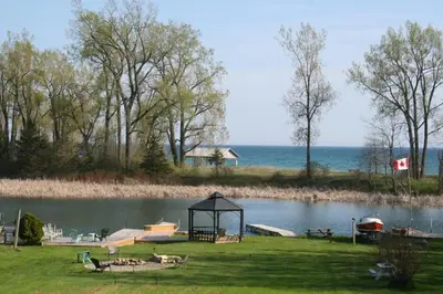 a view of a lake with a gazebo at Hadovka Lakeside Inn in Wellington