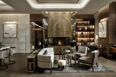 a lobby of a hotel with a fireplace at The St. Regis Toronto in Toronto