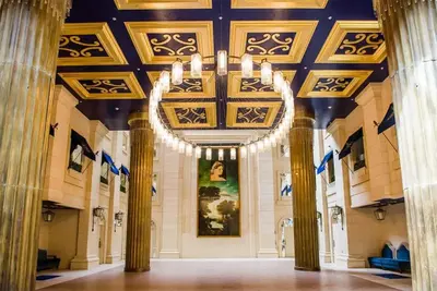 a large chandelier hanging from the ceiling in a building at Windsor Arms Hotel in Toronto