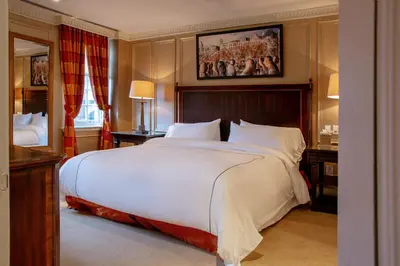 a bedroom with a large white bed in a room at Windsor Arms Hotel in Toronto