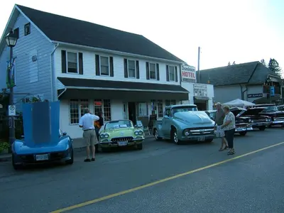 a group of old cars parked on the side of a street at Dominion Hotel in Minden