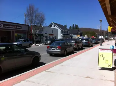 a street with cars parked on the side of the road at Dominion Hotel in Minden