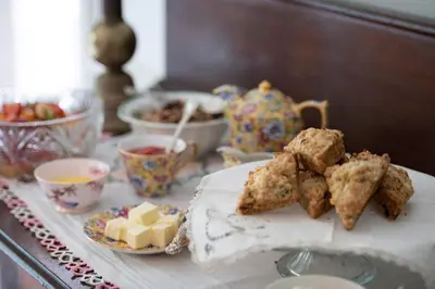 a table topped with plates of food and tea cups at TwiningRetreat in Niagara on the Lake