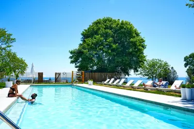 a woman and a child playing in a swimming pool at The Lakeside Prince Edward County in Wellington