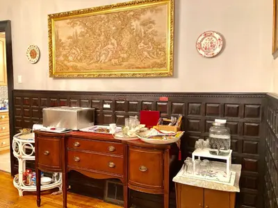 a kitchen with a counter and a painting on the wall at Redwood Bed and Breakfast in Niagara Falls