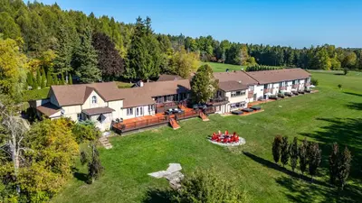 an aerial view of a large house with a large yard at Northumberland Heights Wellness Retreat & Spa in Cobourg