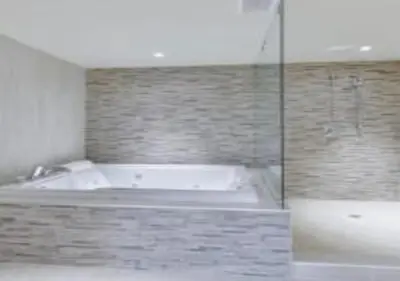 a bathroom with a bath tub and a shower at Northumberland Heights Wellness Retreat & Spa in Cobourg