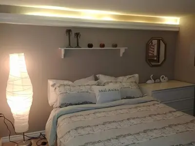 a bedroom with a bed with a shelf above it at Bradford Vacation in Bradford