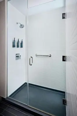 a shower with a glass door in a bathroom at Aloft Vaughan Mills in Vaughan