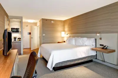 a hotel room with a bed and a television at Hilton Garden Inn Toronto/Mississauga in Mississauga
