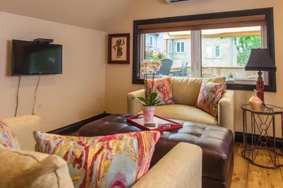 a living room with a couch and a table at Avery House B&B in Stratford