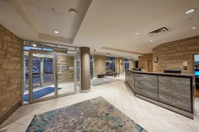 a lobby with a bar in a building at The Falls Hotel & Inn in Niagara Falls