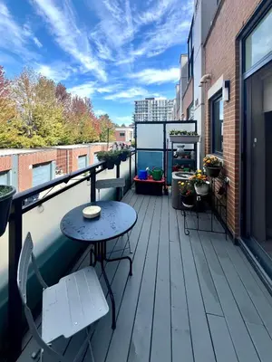 a balcony with a table and chairs on a building at Home in Downtown in Toronto