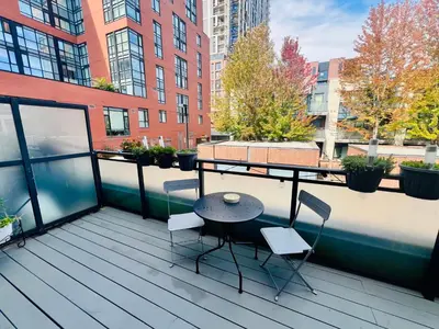 a patio with a table and chairs on a balcony at Home in Downtown in Toronto