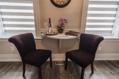 a small table in a room with two chairs at Evanndor in Stratford