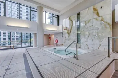 a large bathroom with a tub in a building at Lakefront living Downtown Toronto - Free Parking, Gym, Indoor Pool in Toronto
