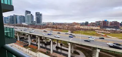 a highway with cars on it in a city at Lakefront living Downtown Toronto - Free Parking, Gym, Indoor Pool in Toronto
