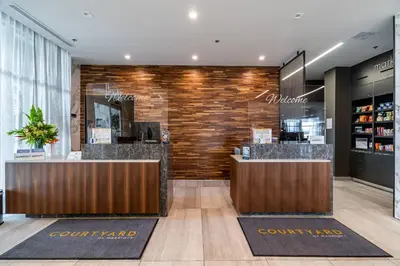 a lobby of a coffee shop with a counter at Courtyard by Marriott Burlington-Oakville in Burlington