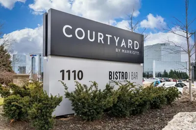 a sign for a county park with cars in a parking lot at Courtyard by Marriott Burlington-Oakville in Burlington