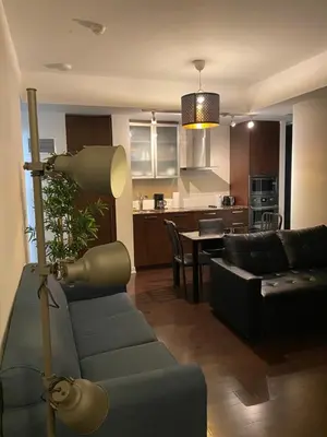 a living room with a couch and a table at Stylish Condos Toronto in Toronto