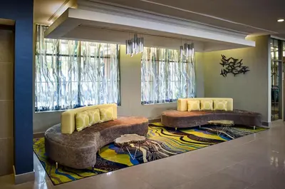 two couches in a room with two windows at Waterfront Hotel Downtown Burlington in Burlington