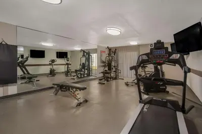 a gym with several exercise bikes and a tv at Best Western Brantford Hotel and Conference Centre in Brantford