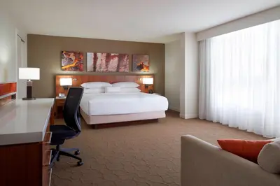 a hotel room with a bed and a desk and a desk at Delta Hotels by Marriott Toronto Airport & Conference Centre in Toronto