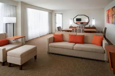 a living room with a couch and a table at Delta Hotels by Marriott Toronto Airport & Conference Centre in Toronto