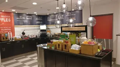 a store with a counter with boxes of food at Hampton Inn & Suites by Hilton Toronto Airport in Mississauga