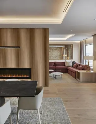 a living room with a couch and a fireplace at Hilton Toronto Airport Hotel & Suites in Mississauga