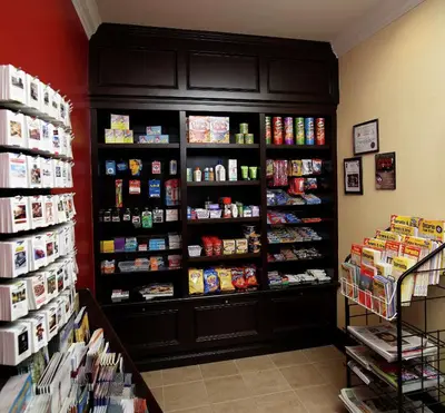 a store with a book shelf filled with food at Hilton Garden Inn Toronto/Ajax in Ajax