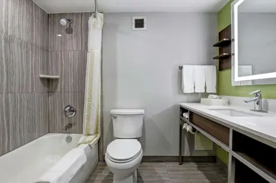a bathroom with a white toilet and a sink at Hilton Garden Inn Toronto/Ajax in Ajax