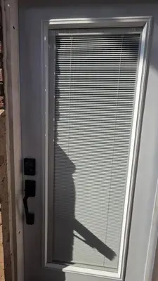 a shadow of a person looking out of a window at Serene Niagara Inn in Niagara Falls