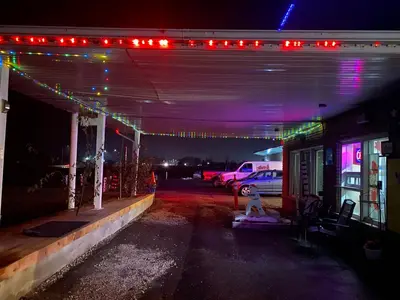 a garage lit up at night with christmas lights at Pleasant Stay Motel in Ancaster