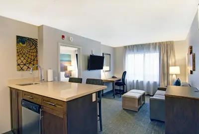 a kitchen and living room in a hotel room at Staybridge Suites Toronto - Vaughan South by IHG in Vaughan