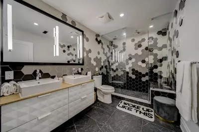 a bathroom with a sink and a toilet and a shower at The Westlake in Toronto