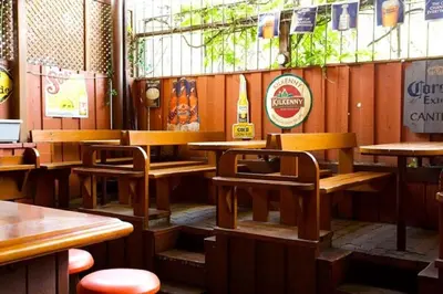 a restaurant with wooden tables and chairs in a room at Madison Manor Boutique Hotel in Toronto