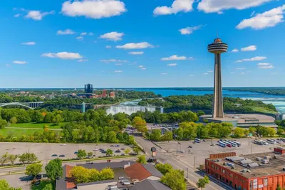 a view of a city with a space needle in the distance at DoubleTree Fallsview Resort & Spa by Hilton - Niagara Falls in Niagara Falls