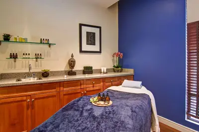 a blue room with a table with a plate of food at DoubleTree Fallsview Resort & Spa by Hilton - Niagara Falls in Niagara Falls