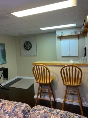 a waiting room with two chairs and a bar at Evening Shade in Fergus