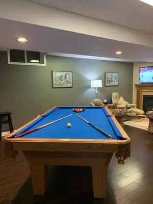 a pool table in a living room with afits at Evening Shade in Fergus