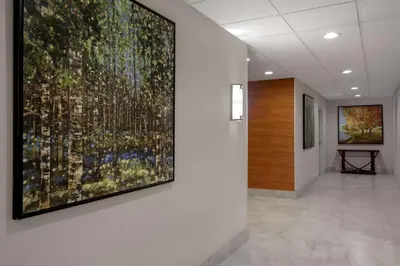a large painting on a wall in a hallway at Hampton Inn by Hilton Brampton - Toronto in Brampton