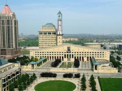 a large building with a clock tower on top of it at Mississauga Furnished Apartments in Mississauga
