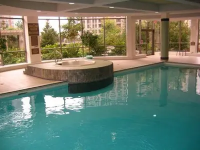 a large swimming pool with a sink in a building at Mississauga Furnished Apartments in Mississauga