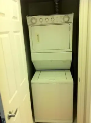 a white washer and dryer in a room at Mississauga Furnished Apartments in Mississauga