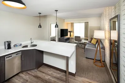 a room with a kitchen and a living room at Residence Inn by Marriott Toronto Mississauga West in Mississauga