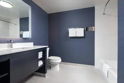 a bathroom with a white toilet and a sink at Residence Inn by Marriott Toronto Mississauga West in Mississauga