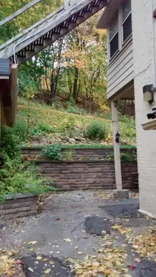 a porch of a house with a brick walkway at McBayne House in Hamilton