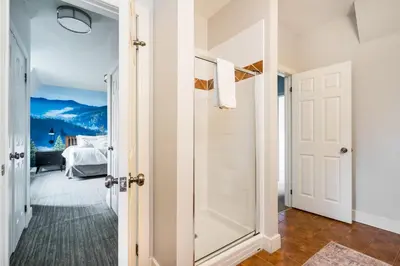 a door leading to a bedroom with a mountain view at Beautiful & Bright 3 Bed Townhome Near Village in Blue Mountains