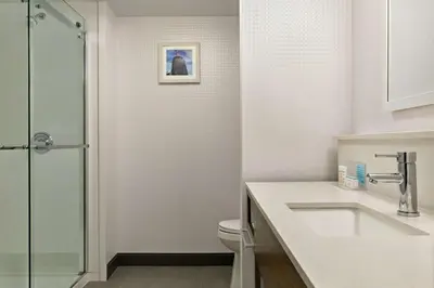 a bathroom with a sink and a toilet at Hampton Inn London Ontario in London